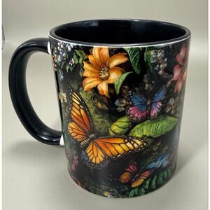 glossy black ceramic mug with a vibrant design of monarch butterflies floral art